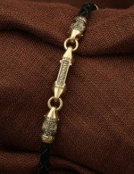 Браслет из лимонного золота c кожаным шнурком и ониксом