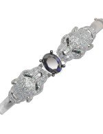 Браслет из белого золота c бриллиантами, сапфиром и изумрудом