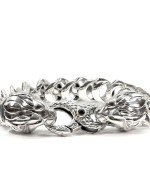 Браслет из серебра и золота c ониксом, изумрудом и рубином