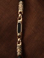 Гайтан из золота c кожаным шнурком и ониксом