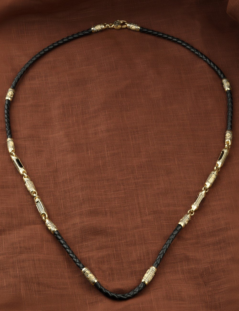 Гайтан из лимонного золота c кожаным шнурком и ониксом