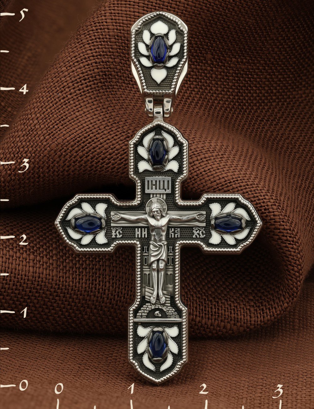 Крест из белого золота c эмалью и сапфиром