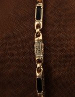 Гайтан из золота c кожаным шнурком и ониксом