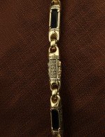 Гайтан из лимонного золота c кожаным шнурком и ониксом